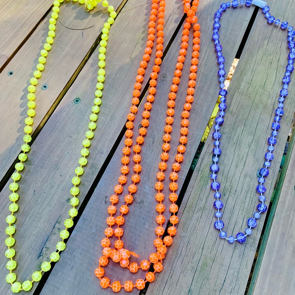 Costume Jewelry (3) plastic beaded necklaces
Child sized purple yellow orange